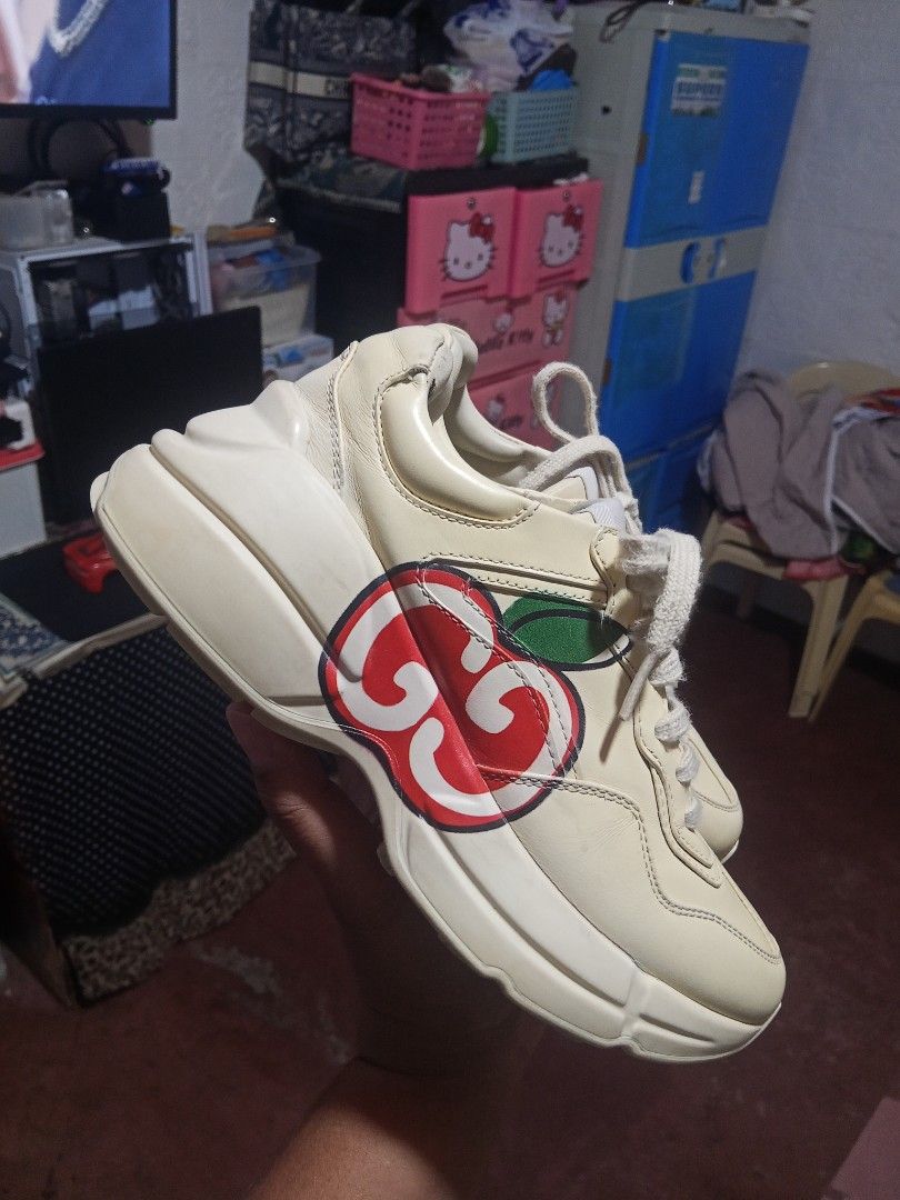 Gucci Rhyton Sneakers (Category: Sneakers) located in Zamboanga. Submitted by alminajammang19 (Listing ID 1428426074, Image 2). Description: Authentic Gucci Rhyton sneakers. Features the iconic Gucci logo on the side and insole. Made in Italy. The shoes have a cream color with a chunky sole. Size 35. Includes the Gucci logo on the tongue and the bottom of the shoe. The shoes have a lace-up closure..