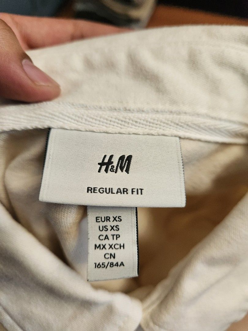 H&M Rugby Shirt - Beige (Category: Tshirts & Polo Shirts ) located in Malabon City. Submitted by silverrust12 (Listing ID 1428289806, Image 3). Description: H&M Rugby Shirt in Beige Bought from store Original price around Php 1,290 Size on tag - XS Pit-to-pit - 47 cm Length - 69 cm (Front), 70 cm (Back) Sleeve length - 59 cm Will be washed and will send more pics upon reservation NCR area Can do meet-ups around SM North or anywhere near LRT stati