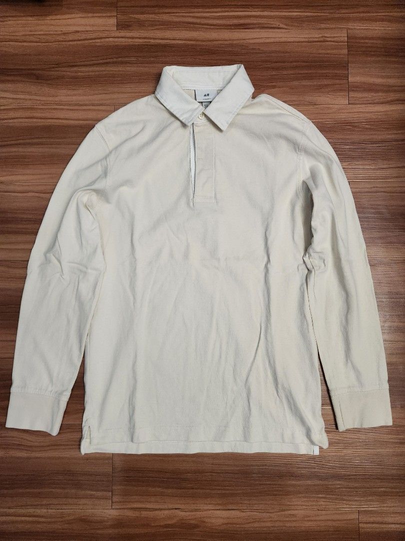 H&M Rugby Shirt - Beige (Category: Tshirts & Polo Shirts ) located in Malabon City. Submitted by silverrust12 (Listing ID 1428289806, Image 1). Description: H&M Rugby Shirt in Beige Bought from store Original price around Php 1,290 Size on tag - XS Pit-to-pit - 47 cm Length - 69 cm (Front), 70 cm (Back) Sleeve length - 59 cm Will be washed and will send more pics upon reservation NCR area Can do meet-ups around SM North or anywhere near LRT stati