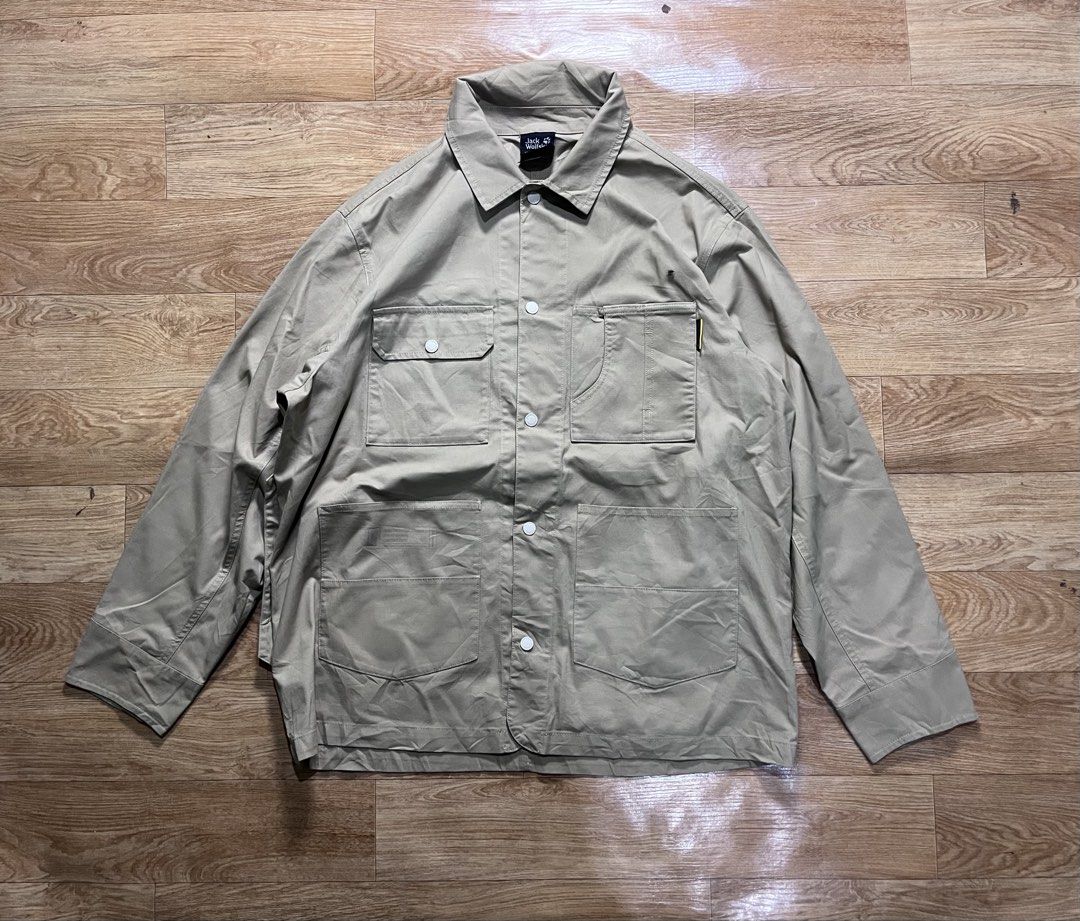 Jack Wolfskin Jacket (Category: Coats, Jackets and Outerwear) located in Zamboanga. Submitted by alterramz08 (Listing ID 1428413212, Image 1). Description: Jack Wolfskin Multi pocket Jacket Size xl W25 L30 Price ; 800 Jack Wolfskin jacket. Features multiple pockets, including two chest pockets and two lower pockets. The jacket has a button-up front and buttoned cuffs. The Jack Wolfskin logo is visible on the collar and a small tag on the pocket. 