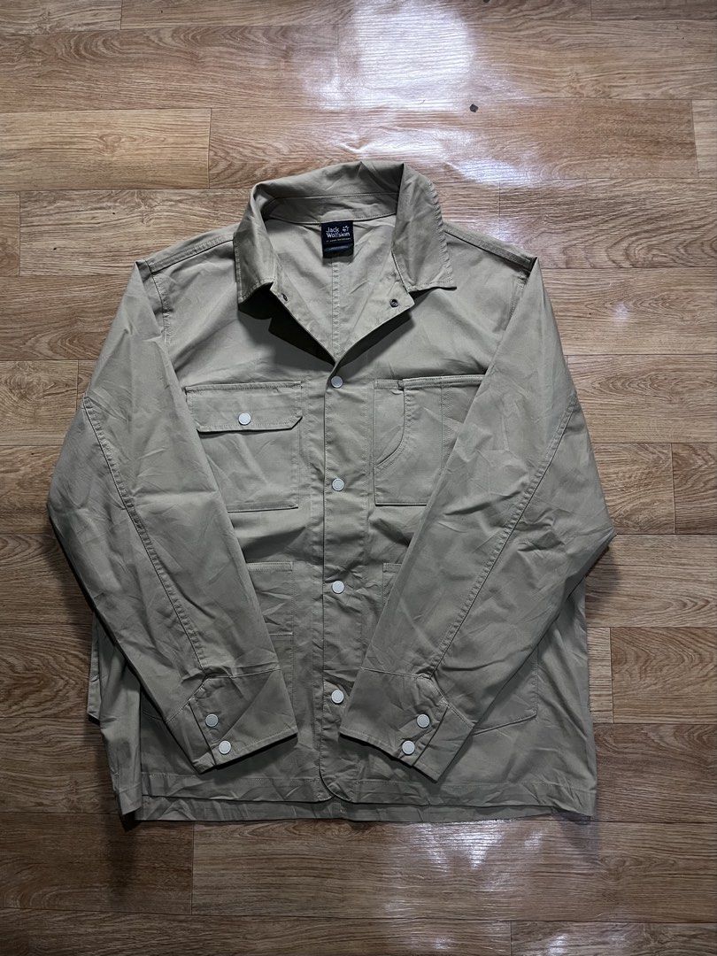 Jack Wolfskin Jacket (Category: Coats, Jackets and Outerwear) located in Zamboanga. Submitted by alterramz08 (Listing ID 1428413212, Image 2). Description: Jack Wolfskin Multi pocket Jacket Size xl W25 L30 Price ; 800 Jack Wolfskin jacket. Features multiple pockets, including two chest pockets and two lower pockets. The jacket has a button-up front and buttoned cuffs. The Jack Wolfskin logo is visible on the collar and a small tag on the pocket. 