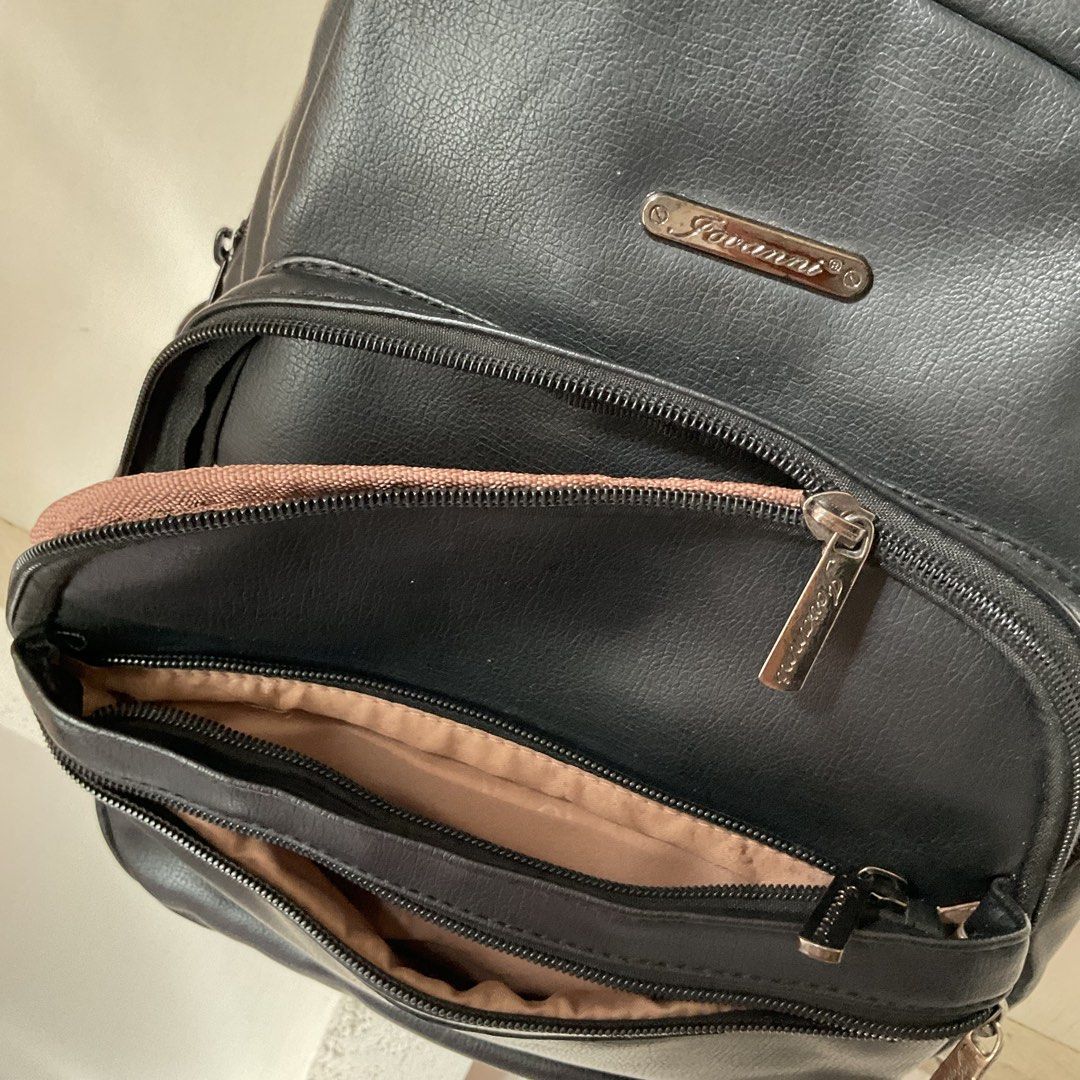 Black Backpack (lots of pockets, leather) (Category: Backpacks) located in Iloilo. Submitted by vanfits (Listing ID 1428324596, Image 2). Description: Features: - 6 external pockets (compartments) + 1 hidden pocket - Fits with 11-inches book as showned in the picture - Washable - Not easily get wet (inside) - Adjustable strap - LOTSSS of pockets - Well-cared 🎒.