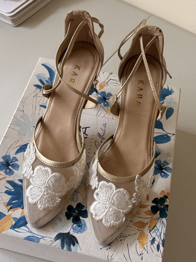 KARA ZAPATOS CUSTOMIZED BRIDAL SHOES (Category: Heels) located in Manila. Submitted by prelovedbymrsd (Listing ID 1428322764, Image 1). Description: Selling my customized bridal shoes Used it a few hours during the wedding SHOE DETAILS Size: size 7 Color / Materials: gold strap (self-tie) HEEL HEIGHT: 3 inches pointed heels very comfortable to wear 🤍 Had it custom made for ₱4,000 Selling it for 2,300 LOC: BF Homes,Parañaque.