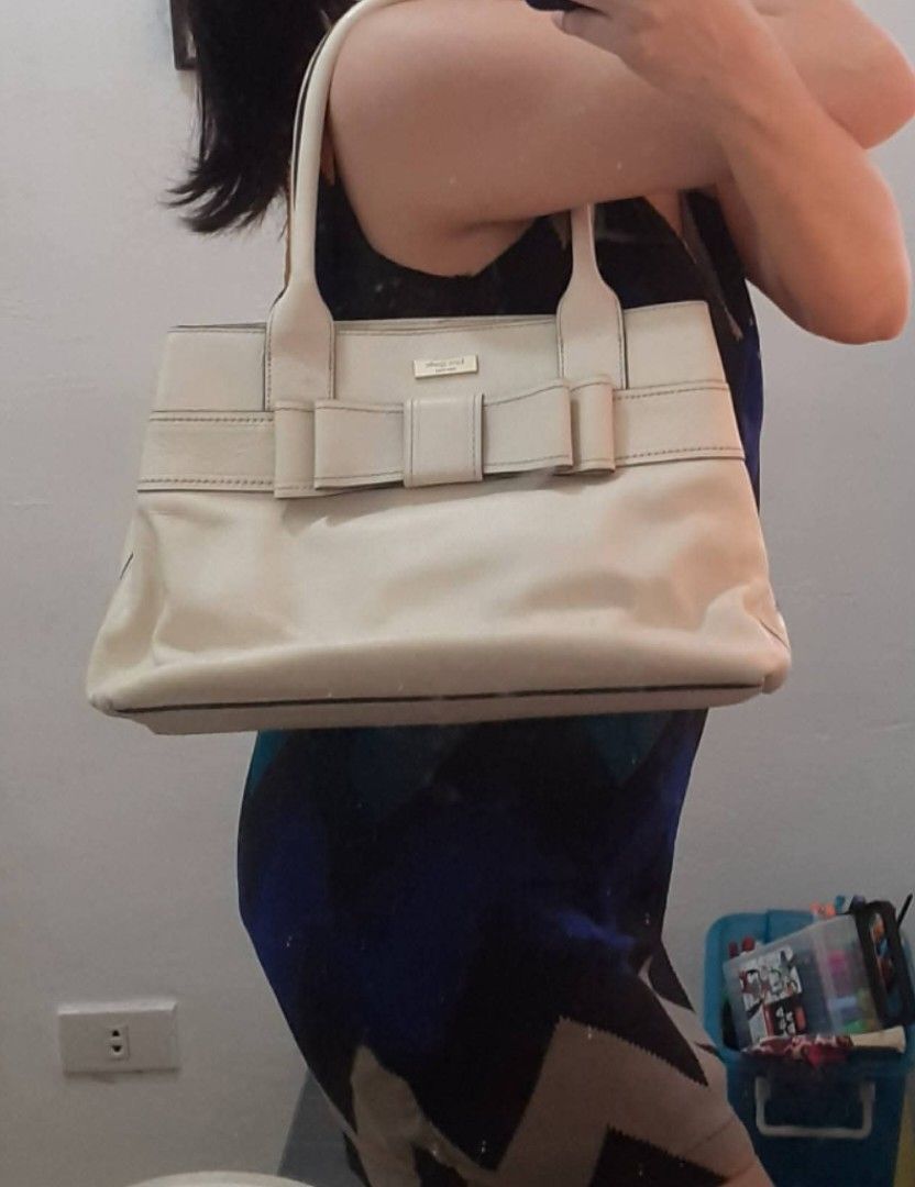 Kate Spade Bow CREAM leather Handbag (Category: Luxury Bags & Wallets) located in Navotas City. Submitted by ms.soulana (Listing ID 1428353668, Image 1). Description: PREOWNED LIGHTLY USED Authentic KATE SPADE BOW DETAILED CREAM LEATHER HANDBAG LARGE wth Polka Printed Cloth lining Min Sign of Used Good Condition 9/10 .