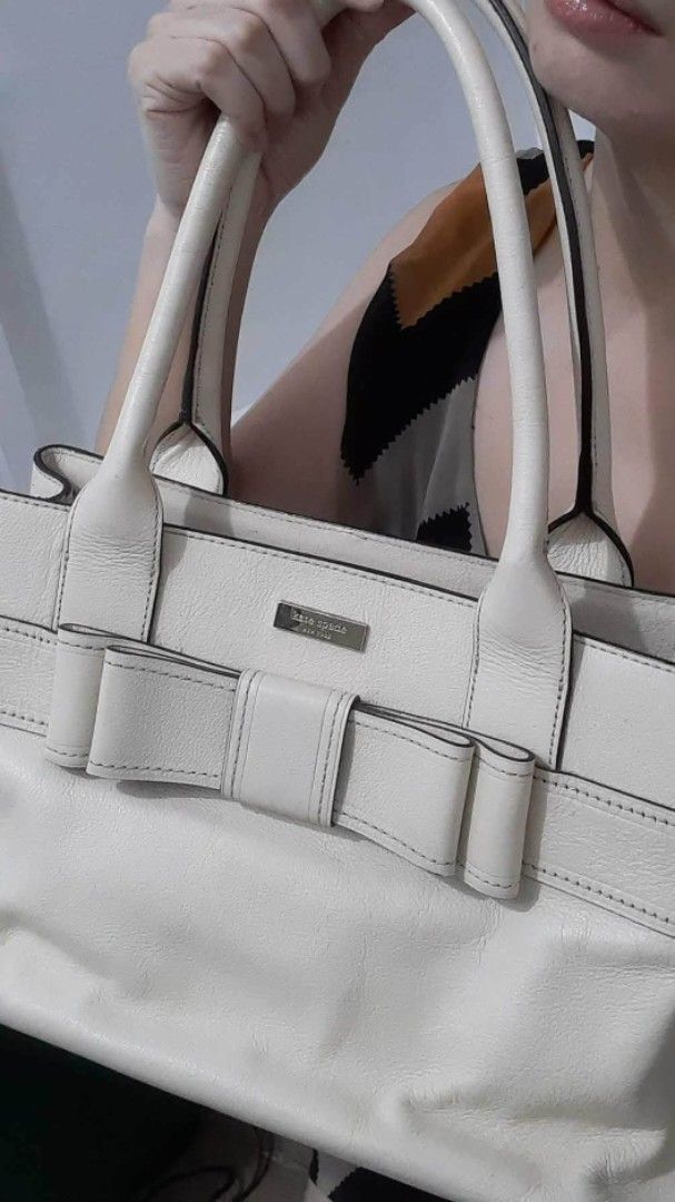 Kate Spade Bow CREAM leather Handbag (Category: Luxury Bags & Wallets) located in Navotas City. Submitted by ms.soulana (Listing ID 1428353668, Image 2). Description: PREOWNED LIGHTLY USED Authentic KATE SPADE BOW DETAILED CREAM LEATHER HANDBAG LARGE wth Polka Printed Cloth lining Min Sign of Used Good Condition 9/10 .