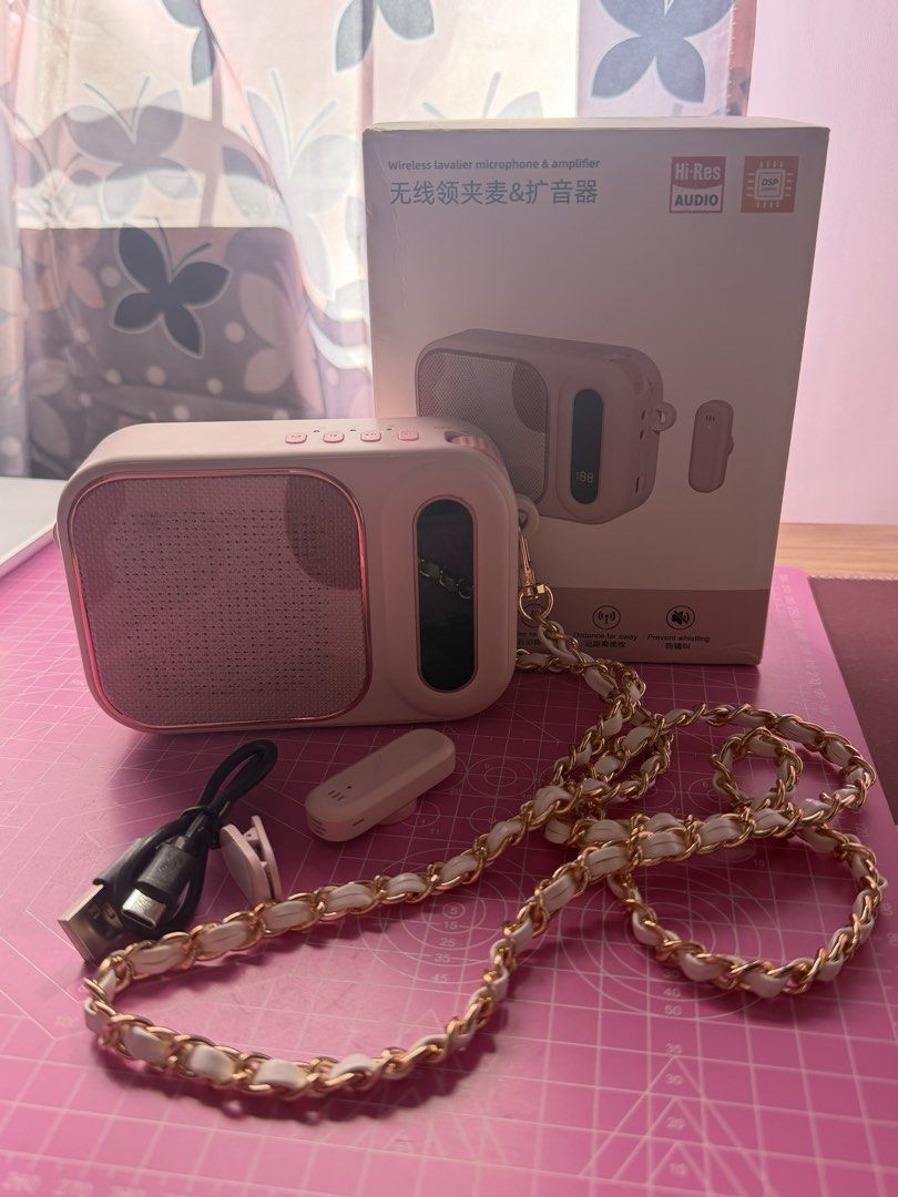 LAPEL Wireless Lavalier Microphone & Amplifier (Category: Microphones) located in Pasig City. Submitted by itsdefjenny (Listing ID 1428261774, Image 2). Description: Wireless microphone and amplifier combo is perfect for on-the-go use. It features a built-in speaker and a stylish design with a chain strap. The set includes the microphone, amplifier, charging cable, and a box. - Used once.