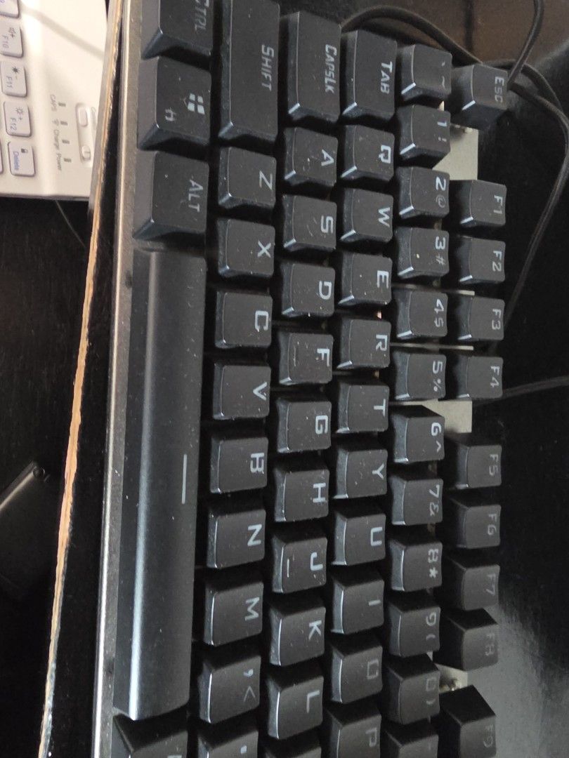 LOQ Mechanical Keyboard (Category: Computer Keyboard) located in Quezon City. Submitted by kentmaguid20 (Listing ID 1428322043, Image 3). Description: LOQ mechanical keyboard. Features a full-sized layout with a numeric keypad. The keyboard has black keycaps. The back of the keyboard shows the model number and other specifications. It is a wired keyboard. The keyboard has a silver frame..