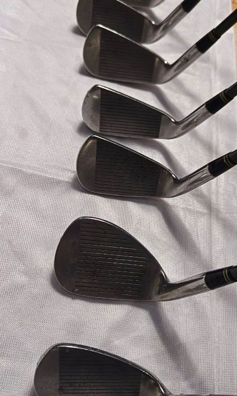 Maxfli Tour Cavity Golf Iron Set (Category: Golf) located in Manila. Submitted by yeonmei5614747 (Listing ID 1425648864, Image 3). Description: Complete set of Maxfli Tour Cavity golf clubs. Includes clubs numbered 3, 4, 5, 6, 7, 9, and A. The shafts are black with gold accents. The grips are black. Made in Japan..