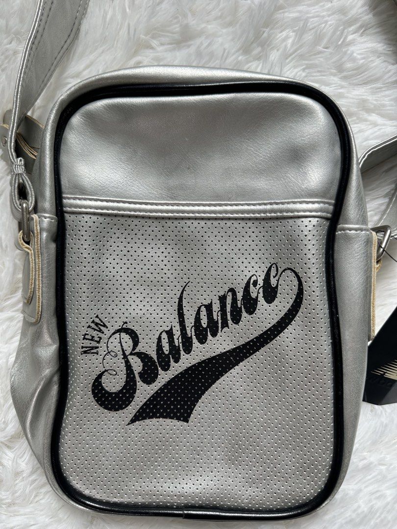 New Balance Silver Crossbody Bag (Category: Sling Bags) located in Manila. Submitted by johnmoral58013 (Listing ID 1428300504, Image 2). Description: Level up your street style with this head-turning Silver New Balance Crossbody Bag. Perfectly blending vintage athletic aesthetics with a modern metallic pop, this is the “it” accessory your wardrobe has been waiting for. Why You’ll Love It: • Standout Style: Eye-catching silver finish with a cool p