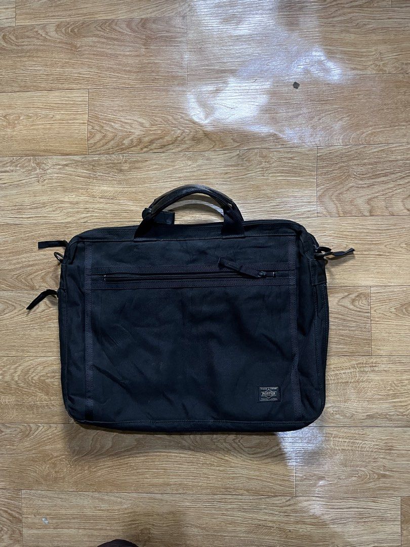 Porter Tokyo Japan Briefcase (Category: Briefcases) located in Zamboanga. Submitted by alterramz08 (Listing ID 1428419454, Image 1). Description: PORTER Clip Briefcase Black Verygood condition Price : 1,200 Black briefcase from Porter Tokyo Japan. Features a top handle and a shoulder strap. Includes multiple compartments with zippers. Made in Japan. The bag has the Porter logo on the front and inside. The bag has a rectangular shape. .
