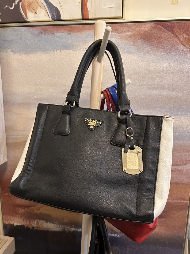 Prada Black and White Tote Bag (Category: Luxury Bags & Wallets) located in Cebu City. Submitted by janinedjrod (Listing ID 1428371651, Image 1). Description: Thrifted from a Japanese thriftstore. .