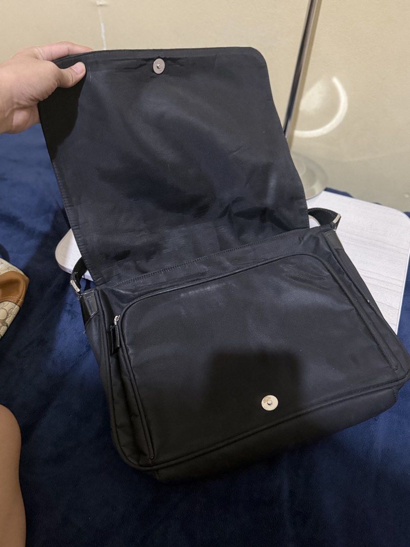 Prada Crossbody Messenger Nylon Bag (Category: Luxury Bags & Wallets) located in Cagayan de Oro. Submitted by twice.but.nice.blackmarket (Listing ID 1428364491, Image 3). Description: - Lightly use Condition - Height 10 - Width 13 - Color rate 9 close to 9.5 - Flaws or issues sign of usages but not visible! - Lightly negotiable ‼️.
