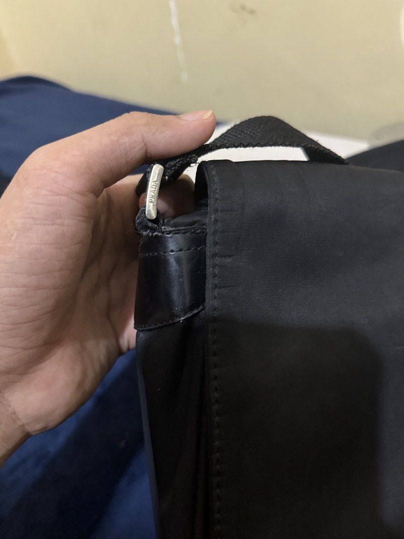 Prada Crossbody Messenger Nylon Bag (Category: Luxury Bags & Wallets) located in Cagayan de Oro. Submitted by twice.but.nice.blackmarket (Listing ID 1428364491, Image 2). Description: - Lightly use Condition - Height 10 - Width 13 - Color rate 9 close to 9.5 - Flaws or issues sign of usages but not visible! - Lightly negotiable ‼️.