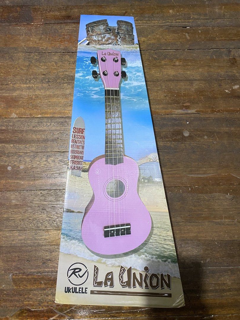 RJ La Union Ukulele Soprano with Bag (Category: Musical Instruments) located in Makati City. Submitted by lasthing.22 (Listing ID 1428423288, Image 1). Description: La Union ukulele comes with a black finish and a matching carrying case. The ukulele features a black headstock with the brand name in gold lettering. The body has a round sound hole and white accents. The included case has a zipper closure and the RV logo. RFS: Declutter With origina