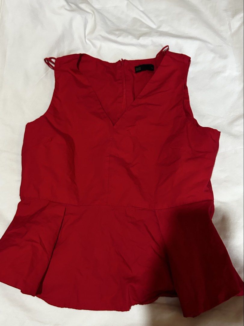 SEED Red Peplum Top [XL] (Category: Sleeveless) located in Caloocan City. Submitted by ctrl12 (Listing ID 1425863795, Image 3). Description: Red peplum top from SEED. Features a V-neckline and a zipper closure at the back. Includes a black ribbon tie at the back. Size XL. Selling this for a friend MOP: GCash MOD: J&T/Lalamove.