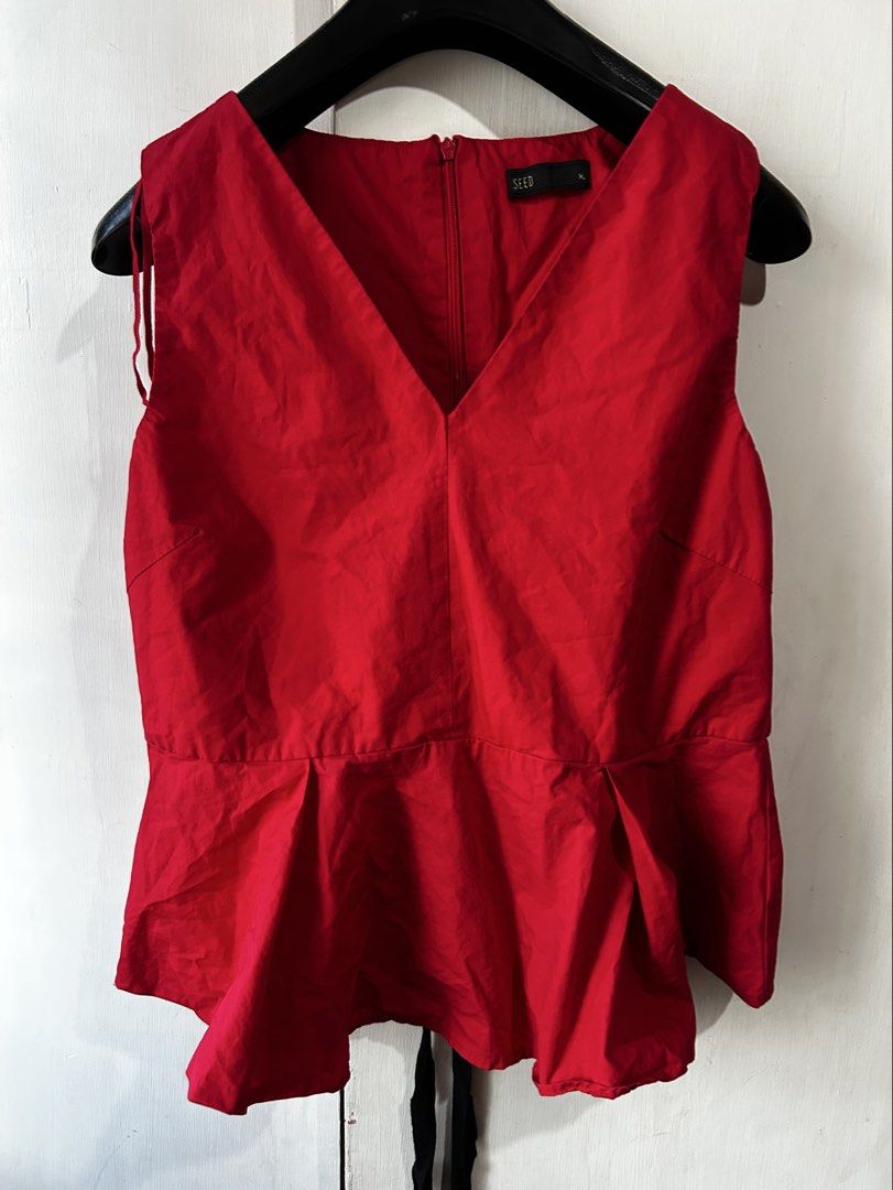 SEED Red Peplum Top [XL] (Category: Sleeveless) located in Caloocan City. Submitted by ctrl12 (Listing ID 1425863795, Image 1). Description: Red peplum top from SEED. Features a V-neckline and a zipper closure at the back. Includes a black ribbon tie at the back. Size XL. Selling this for a friend MOP: GCash MOD: J&T/Lalamove.