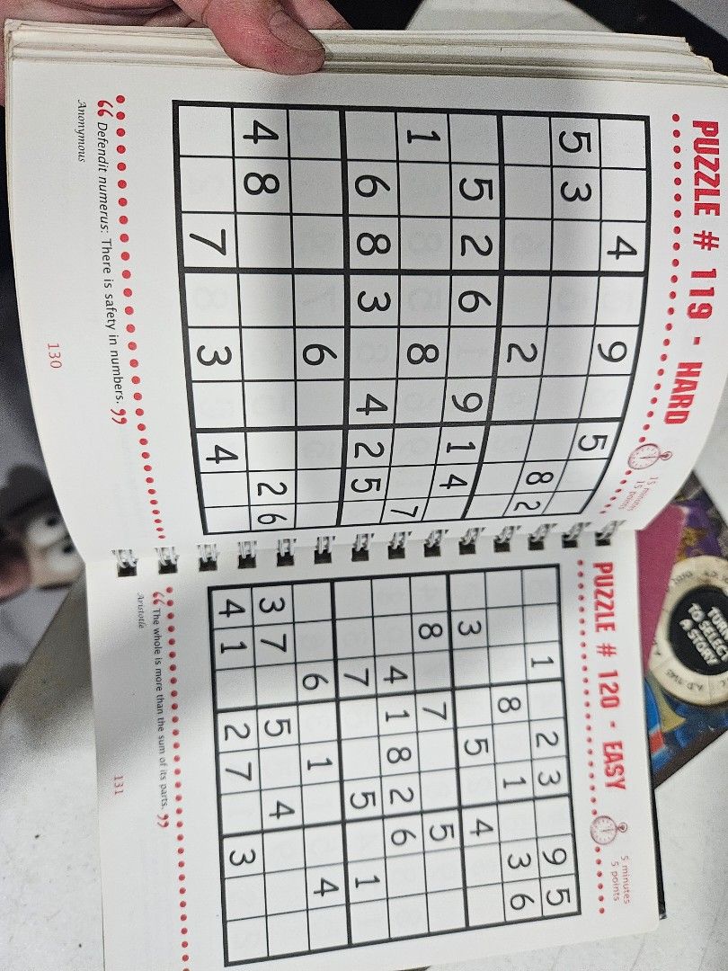 Sensational Sudoku Puzzle Book (Category: Board Games & Puzzles) located in Manila. Submitted by just_about_anything (Listing ID 1428327462, Image 2). Description: Sensational Sudoku puzzle book offers over 200 graded puzzles with expert tips. It features easy-to-use spiral format. The book includes puzzles of varying difficulty levels, from easy to hard. Some puzzles have been solved, as seen in the images. The book is a great way to challenge y