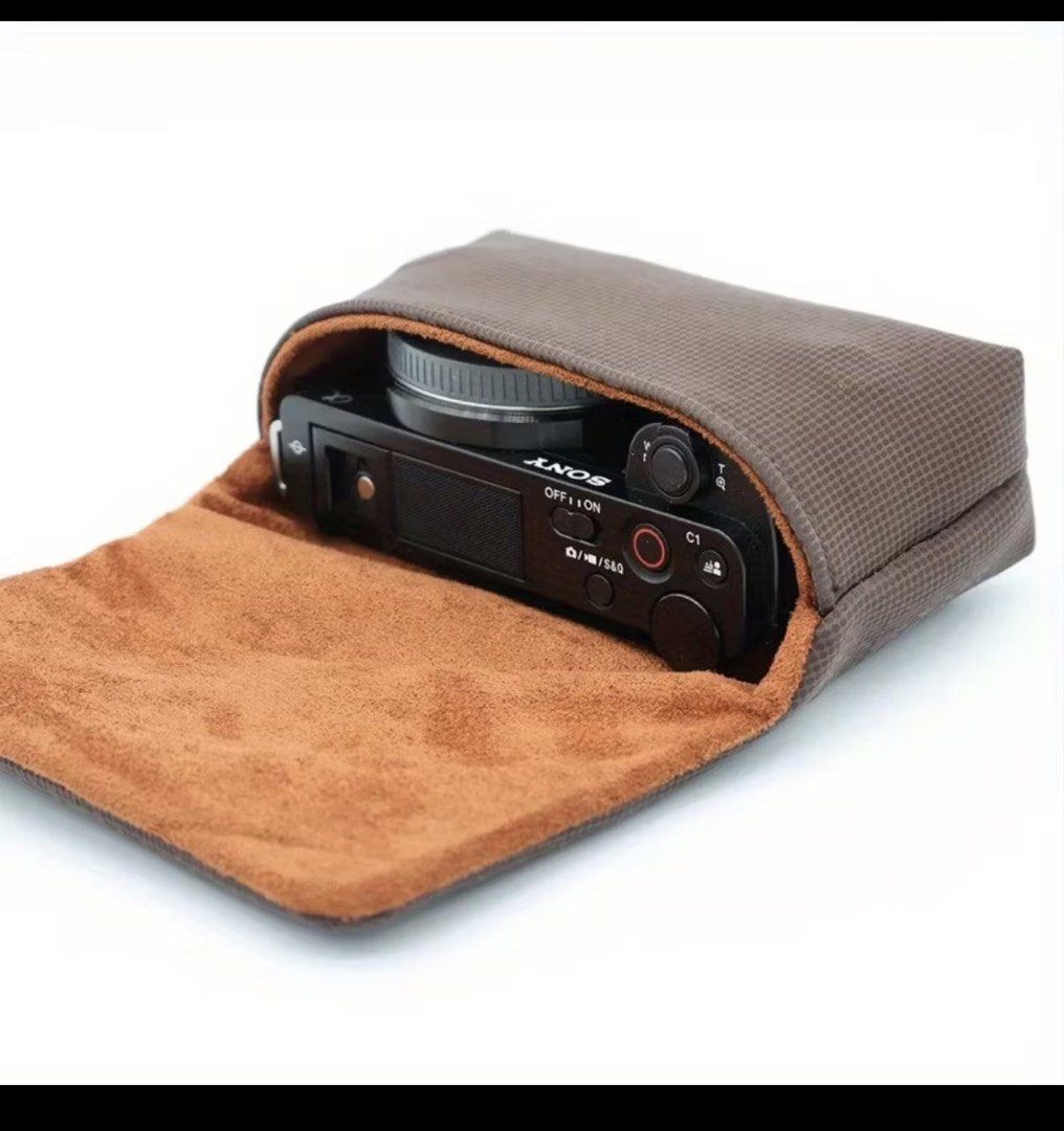 Soft camera pouch (Category: Camera Bags & Carriers) located in Quezon City. Submitted by charmerchant (Listing ID 1428326550, Image 2). Description: Kept unused Has pocket for extra battery Suitable for small EDC/ pocket camera Like Eos body, Ricoh GR, and digicams Issue: Magnet inside is misaligned already.