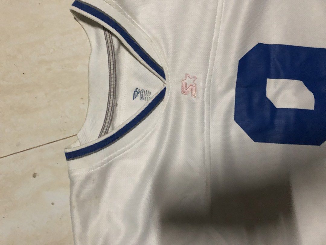 Starter Romo #9 Jersey (Category: Activewear) located in Manila. Submitted by kuyswex (Listing ID 1428268647, Image 2). Description: White jersey with blue accents. Features the number 9 on the front and back. The name "ROMO" is printed on the back. The Starter logo is visible on the front and the collar. The jersey has short sleeves and a V-neck collar..