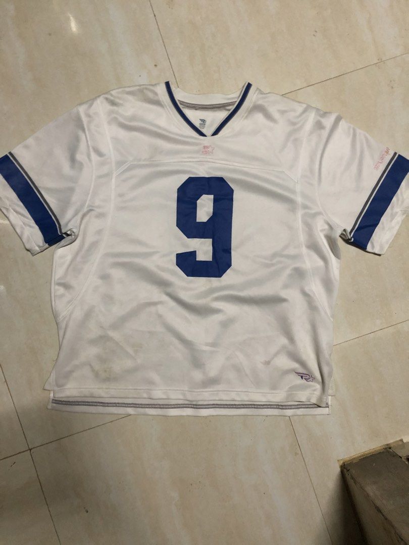 Starter Romo #9 Jersey (Category: Activewear) located in Manila. Submitted by kuyswex (Listing ID 1428268647, Image 1). Description: White jersey with blue accents. Features the number 9 on the front and back. The name "ROMO" is printed on the back. The Starter logo is visible on the front and the collar. The jersey has short sleeves and a V-neck collar..