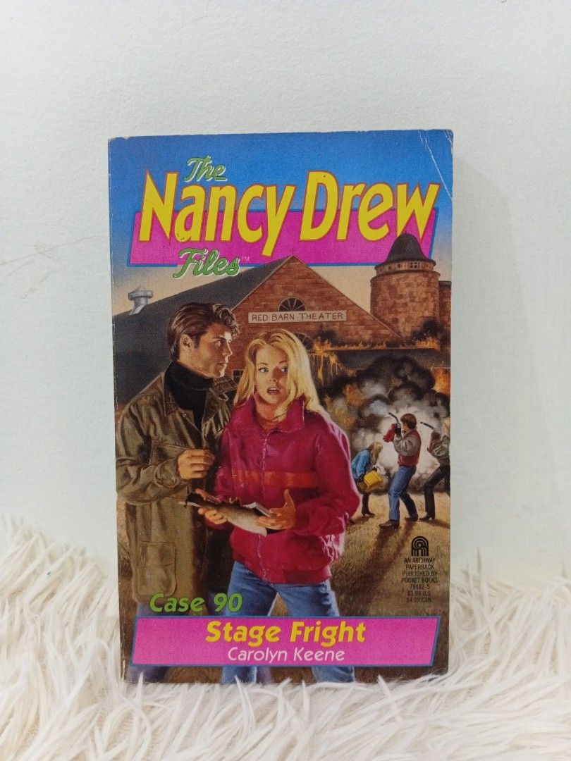 The Nancy Drew Files Case 90: Stage Fright (Category: Storybooks) located in Cavite. Submitted by nathstelein_finds (Listing ID 1428349748, Image 1). Description: Copy of The Nancy Drew Files Case 90: Stage Fright by Carolyn Keene. The book features a mystery involving arson and a theater. The pages are slightly yellowed with age. The cover shows some wear and tear. The book is in English..
