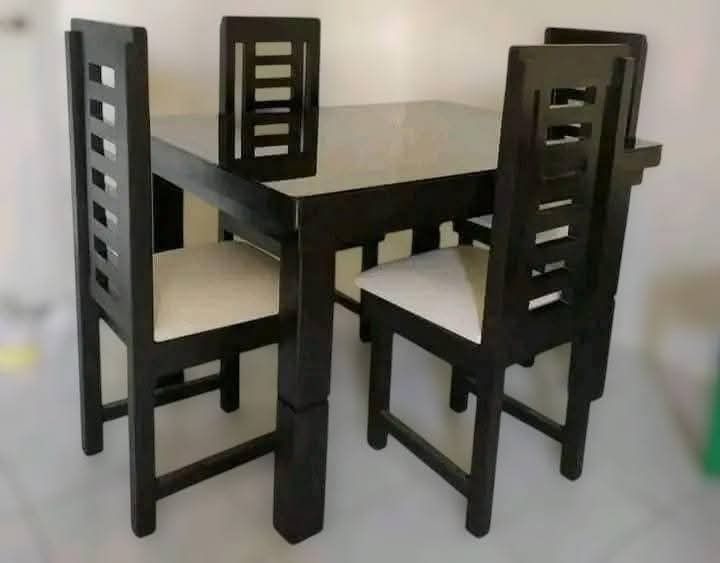 Wooden Dining Table Set with Chairs (Category: Tables & Sets) located in Mabalacat. Submitted by arlenemamangun01 (Listing ID 1428296070, Image 2). Description: High-quality Dining table set at an affordable price👌 Materials used: 📌Gemelina & mahogany wood 📌Uratex foam 📌German leather & fabric 📌Duco paint finished MADE TO ORDER⚒️ NO DP NEEDED✅ FREE TOP GLASS😍 COD & FREE DELIVERY 4 seater (3ft by 4ft) 6 seater (3ft by 5ft) 8 seater (3ft by 6