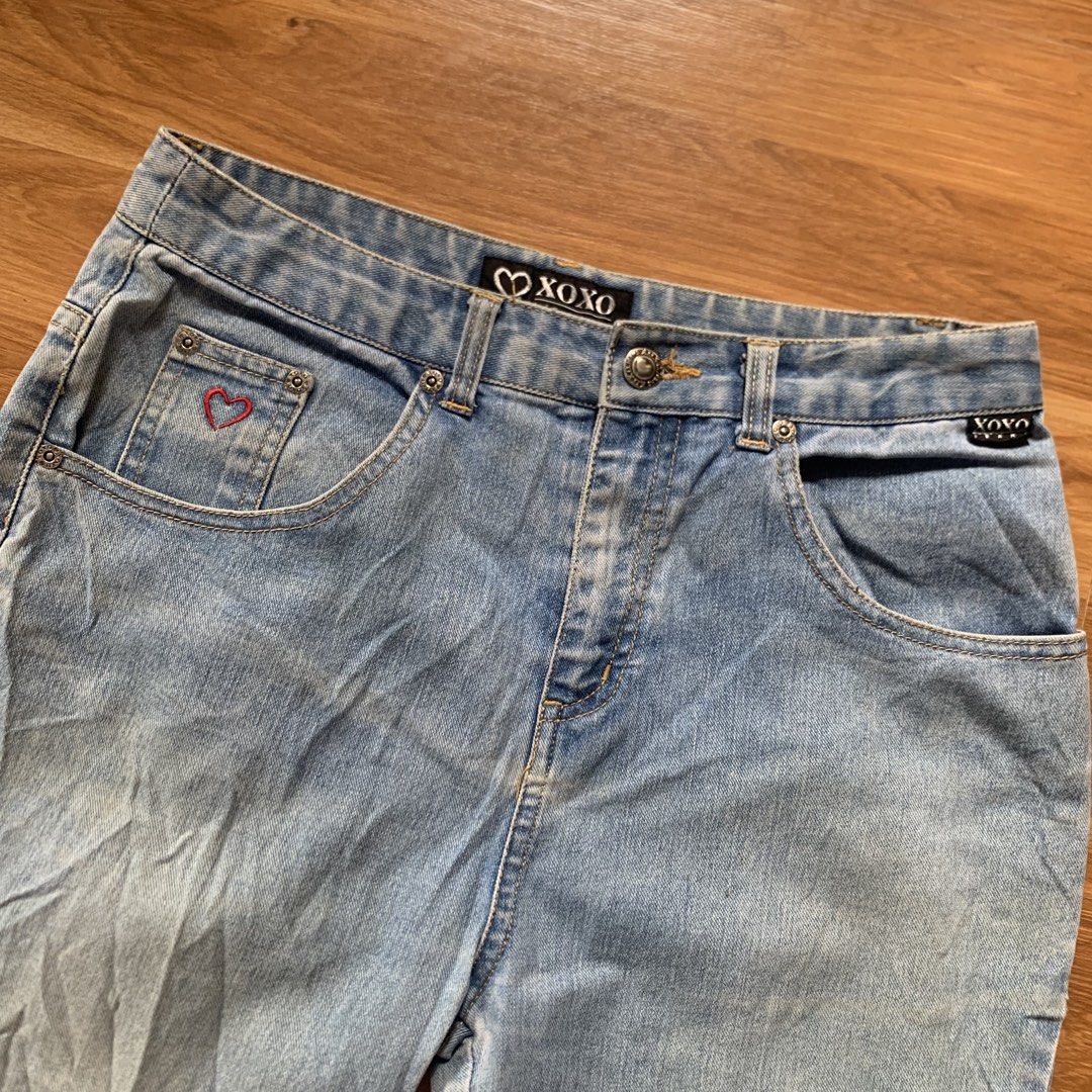XOXO Jeans Flare Pants Size 16 (Category: Jeans) located in Calauan. Submitted by randomthrift.womens (Listing ID 1428277274, Image 2). Description: XOXO Jeans flare pants in light blue. Features a heart detail on the front pocket. Size 16. Waist measures approximately 14 inches across. Inseam is about 30 inches. Made of 62% cotton, 36.5% polyester, and 1.5% spandex. Made in China..