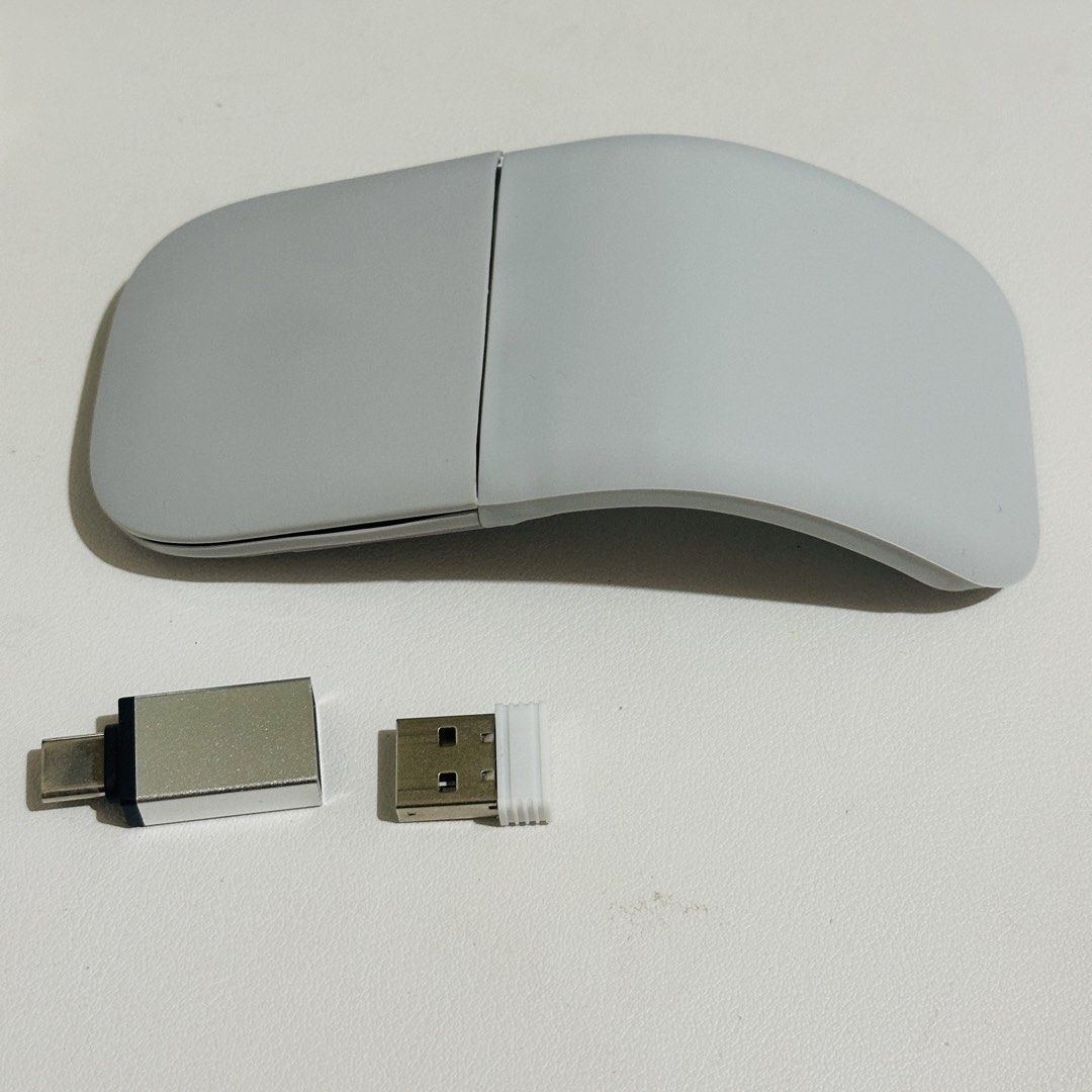 Arc Wireless Mouse with USB and USB-C Adapters (Category: Mouse & Mousepads) located in Kawit. Submitted by eileenanghela (Listing ID 1428581098, Image 1). Description: Wireless Arc mouse Color: light gray Package: Box Manual USB receiver USB-C adapter Good as new Rfs: Too big for me. My hands are a bit small.