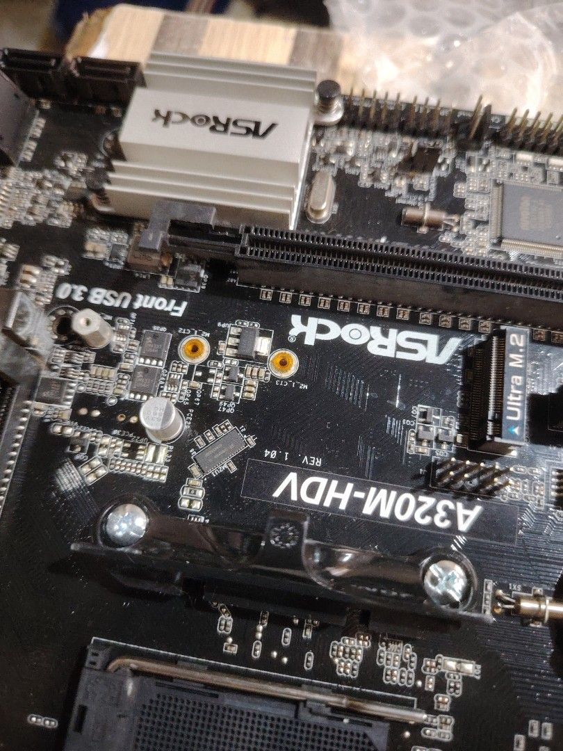 ASRock A320M-HDV Motherboard (Category: Computer Parts) located in Marikina City. Submitted by lumaynojan17296 (Listing ID 1428495633, Image 3). Description: ASRock A320M-HDV motherboard. Features include Ultra M.2 slot, PCI Express 3.0, and front USB 3.0 ports. Compatible with AMD processors. The board has various ports for connectivity. The model name is clearly visible on the board..