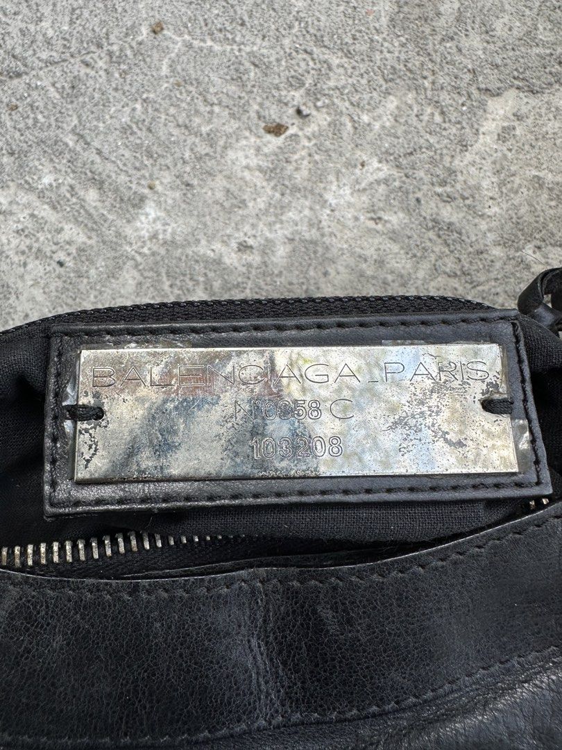 Balenciaga Classic City Handbag (Category: Luxury Bags & Wallets) located in Santa Rosa. Submitted by archivedrip (Listing ID 1428590039, Image 2). Description: Black Balenciaga Classic City handbag. Features a braided top handle and a detachable shoulder strap. Includes a front zip pocket and silver-tone hardware. The interior has a zip pocket. Made in Italy. The zipper has a "LAMP" marking..
