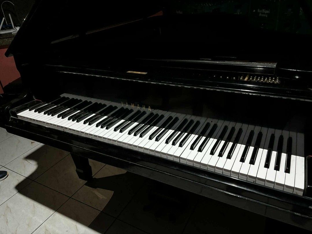 Black Grand Piano (Category: Musical Instruments) located in Quezon City. Submitted by mikelfx (Listing ID 1428546423, Image 1). Description: Elegant black grand piano. Features a full keyboard with black and white keys. The piano has a glossy finish. Perfect for music enthusiasts or those looking to add a touch of sophistication to their space..