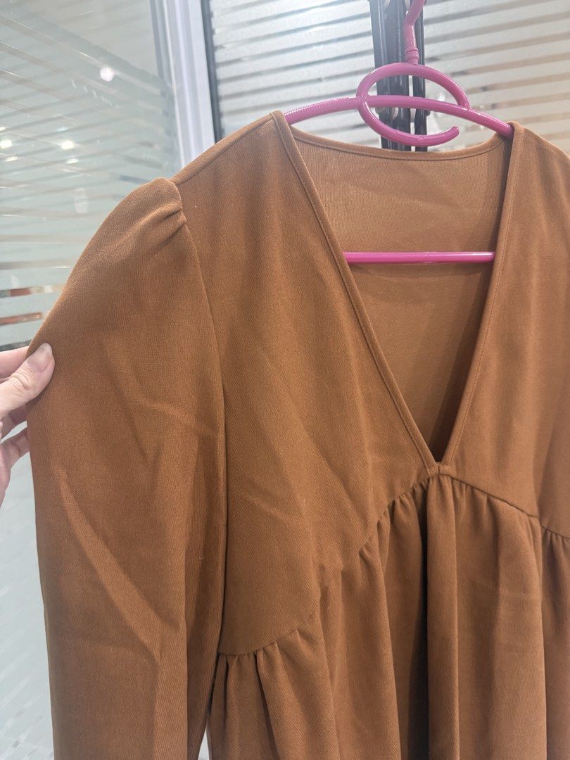 Brown V-Neck Long Sleeve Dress (Category: Dresses) located in Arayat. Submitted by ico_riv (Listing ID 1428471239, Image 3). Description: Dress features a flattering V-neckline and long sleeves. It has a gathered detail under the bust, creating a flowy silhouette. The sleeves have a slight puff at the shoulders and are finished with ruffled cuffs. Fits medium to large..