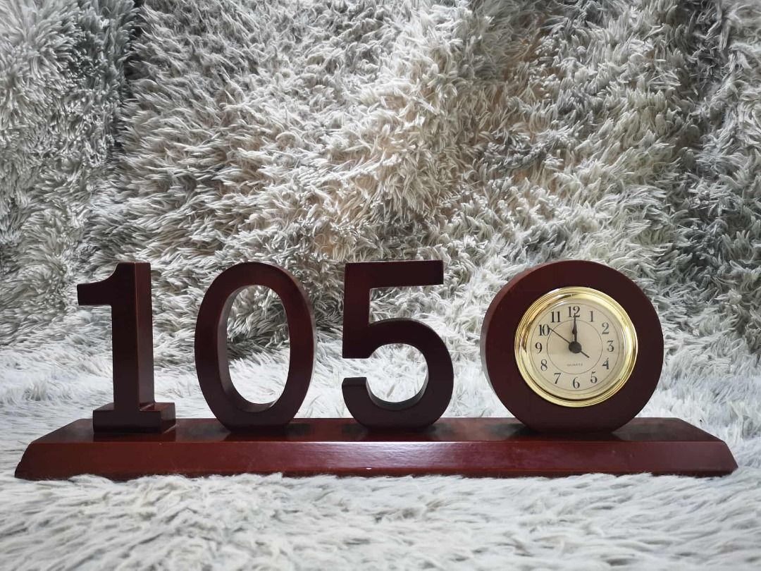 Decorative Wooden Table Clock (Category: Clocks) located in Santa Cruz. Submitted by jmy_surplus.2 (Listing ID 1428518142, Image 1). Description: Size ; L - 15 W - 48 H - 8 Color ; Brown Type ; Table Clock Brand ; No brand Material ; Wood Style ; Wooden Table Clock JMA JMY 5 Batch #195.