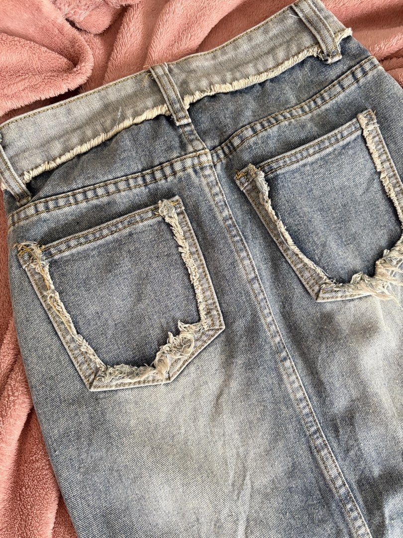 Denim Skirt with Slit - Size XS (Category: Skirts) located in San Carlos City. Submitted by sellwsel (Listing ID 1428492806, Image 3). Description: - edgy denim midi skirt - perf for that ragged look - best fits xxs-xs mop: gcash/maya mod: j&t/lbc.