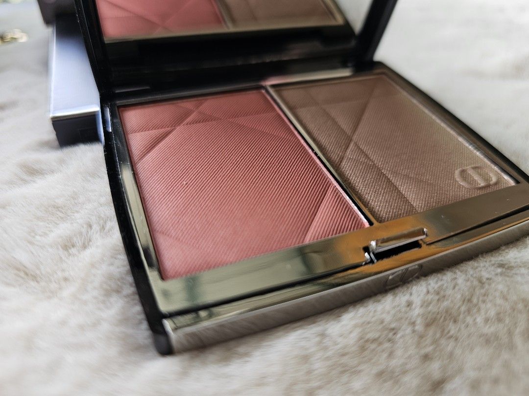Dior Rouge Blush Colour & Glow Palette (Category: Makeup) located in Mandaluyong City. Submitted by heartallthingspretty (Listing ID 1428439700, Image 2). Description: Dior Rouge Blush Colour & Glow palette features a blush and highlighter. The blush is a coral-pink shade, and the highlighter is a bronze-toned colour. The palette includes a mirror. The back of the palette indicates the shade is 257 Dioriviera Blush & Glow. It is a compact size, p