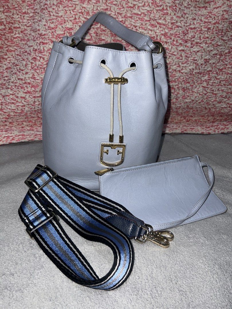 Furla Bucket Bag with Pouch and Strap (Category: Luxury Bags & Wallets) located in Bulacan. Submitted by thriftstationplus (Listing ID 1428563063, Image 1). Description: Made in Italy ✅ Overall Condition - 9/10 💯 % Genuine Leathher 🏆Condition of: 🐮Leather - 9/10 🪨 Edge Paint - 9/10 🛠️Hardwares -9/10 ➰Strap/Sling - Replaced Sling 8.5/10 📉Lining/Edges - 9/10 🧐Interior - 9.8/10 🔗 Puller - 8/10 🧬Measurements: * Height: 10in * Length: 8in * W