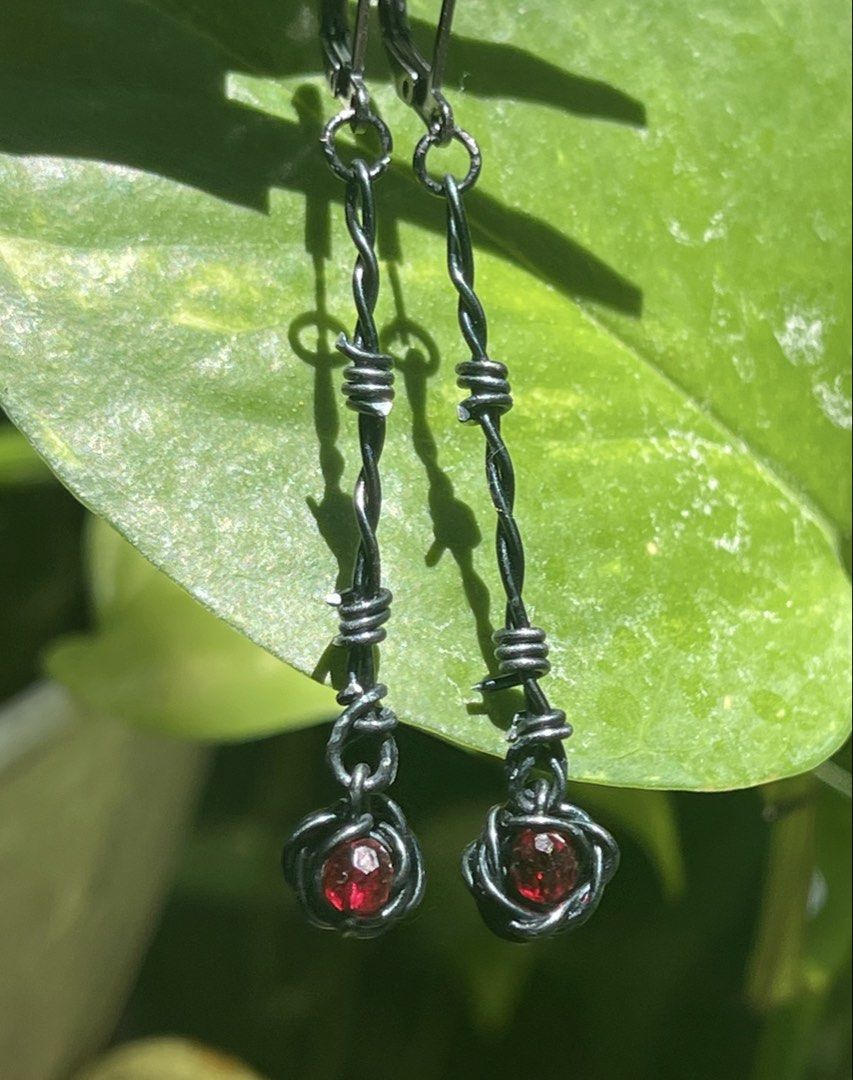 Goth Earrings - Barbed wire with black rose drop (Category: Earrings) located in Muntinlupa City. Submitted by alabangbargains (Listing ID 1428494356, Image 3). Description: Not your soft girl era anymore. These handmade barbed wire earrings are wrapped in dark energy—featuring twisted black copper wire shaped like barbed wire, finished with a delicate black rose bead that feels both fragile and dangerous. 🖤 Lightweight but statement-making 🖤 G