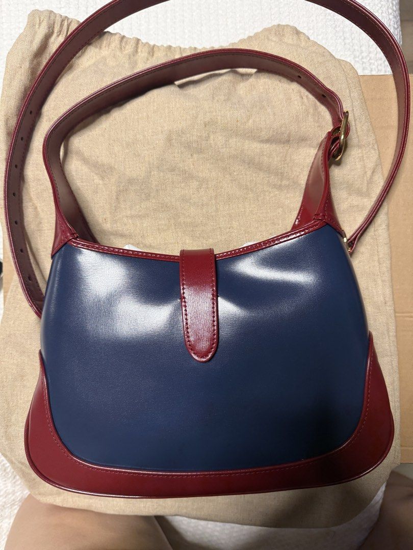 Marked Down! Authentic Gucci Jackie 1961 Shoulder Bag Bicolor (Category: Luxury Bags & Wallets) located in Quezon City. Submitted by mlam71 (Listing ID 1428553255, Image 3). Description: Guaranteed Authentic Used only once, on hand Gucci Jackie 1961 Bicolor (navy and red) All calf leather, gold hardware Shoulder/handbag Details: Blue calfskin leather exterior with red calfskin leather trim, canvas lining and gold-tone hardware Piston lock closure