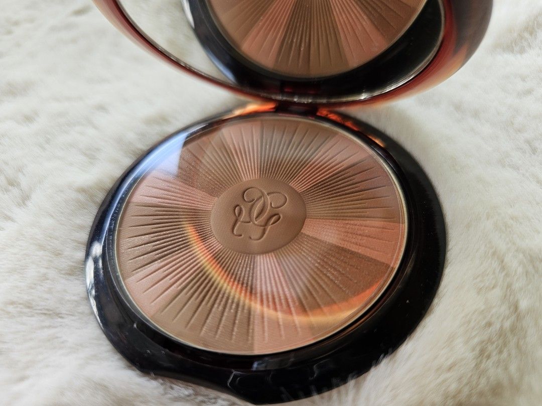 Guerlain Terracotta Light Bronzing Powder 03 (Category: Makeup) located in Mandaluyong City. Submitted by heartallthingspretty (Listing ID 1428439902, Image 2). Description: Guerlain Terracotta Light bronzing powder in shade 03 Natural Warm. The compact includes a mirror. The product is designed to give a sun-kissed glow. It is a light and long-lasting powder. The net weight is 10g / 0.35 oz. Made in France..