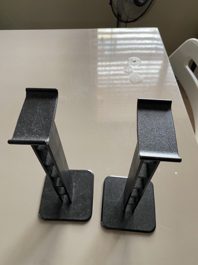Headphone Stands - Black (Category: Headphones & Headsets) located in Makati City. Submitted by rye16 (Listing ID 1428605517, Image 1). Description: Pair of black headphone stands. Features a sturdy base and a design to hold headphones. The stands appear to be made of metal. They are designed to keep your headphones organized and accessible. Perfect for any desk or entertainment setup. 800 for 2.