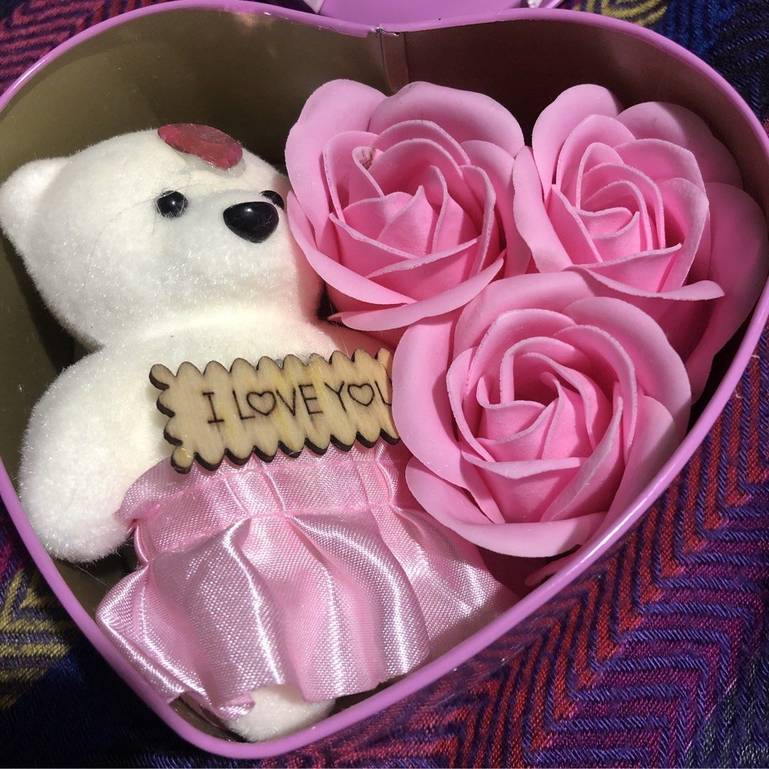 Heart-Shaped Gift Box with Teddy Bear and Roses (Category: Flowers & Bouquets) located in Mandaluyong City. Submitted by jennyitems (Listing ID 1428469495, Image 2). Description: 🌸 Lovely heart-shaped gift box contains a cute teddy bear holding an "I Love You" sign, along with three pink rose-shaped soaps. 🌸 The box is adorned with a pink bow and a "I Love You" tag. Perfect for gifting on special occasions. 🌸 Very Nice & Presentable Gift!🎁 💝