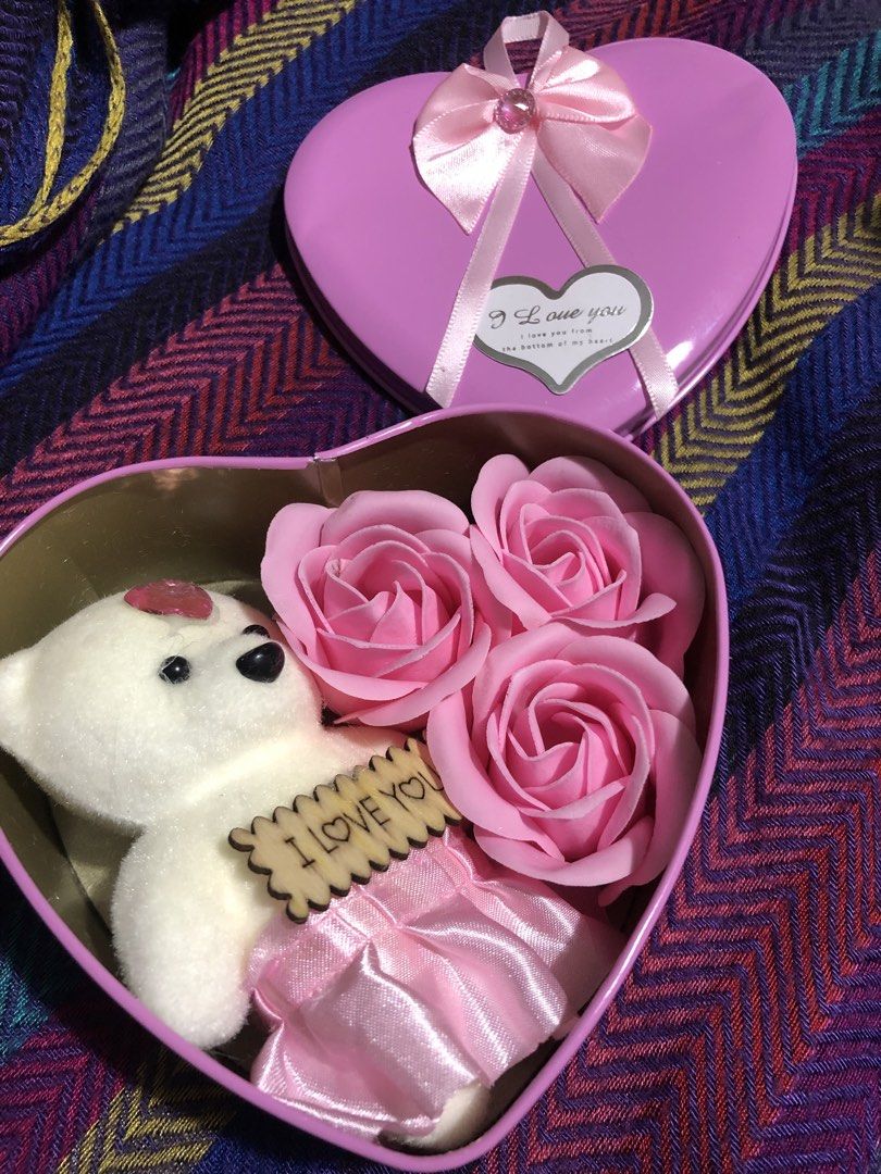 Heart-Shaped Gift Box with Teddy Bear and Roses (Category: Flowers & Bouquets) located in Mandaluyong City. Submitted by jennyitems (Listing ID 1428469495, Image 1). Description: 🌸 Lovely heart-shaped gift box contains a cute teddy bear holding an "I Love You" sign, along with three pink rose-shaped soaps. 🌸 The box is adorned with a pink bow and a "I Love You" tag. Perfect for gifting on special occasions. 🌸 Very Nice & Presentable Gift!🎁 💝