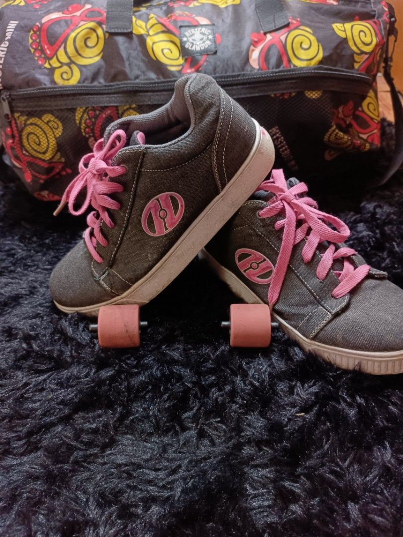 Heelys Grey Roller Shoes (Category: Sneakers) located in Manila. Submitted by brylelee7 (Listing ID 1428600801, Image 1). Description: These Heelys roller shoes feature a grey denim-like upper with pink laces and accents. The shoes have wheels on the soles. The size is US 7, UK 6, EUR 40.5, and CM 26. The shoes come with the wheels installed. The soles show some wear..