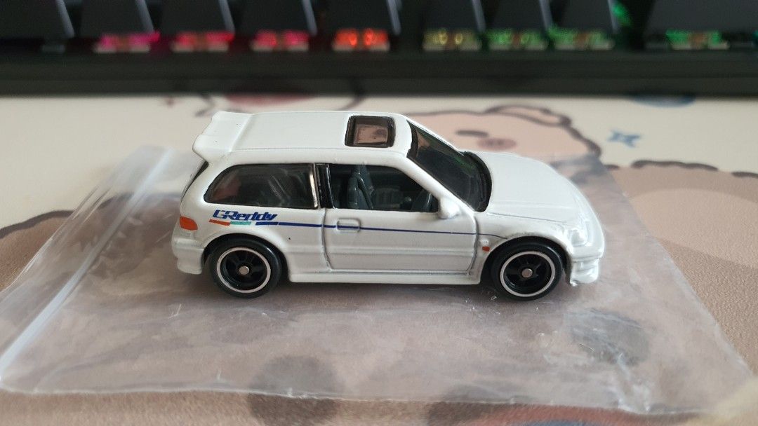 Hotwheels 2019 Super Treasure Hunt STH '90 Honda Civic EF (White) Loose *HTF *JDM *sporty *racing *GREDDY *rubber tires *$TH (Category: Toys & Games) located in Bangi. Submitted by zeuszonic_resources (Listing ID 1428452914, Image 2). Description: *Hotwheels / Hot wheels genuine item. *Rivet. *Headlights / Tail-lights / Factory Detailings. *Scale:1/64. *Condition:9/10 *Loose/old/vintage may have paint imperfections/paint chip/not in 100% perfect 