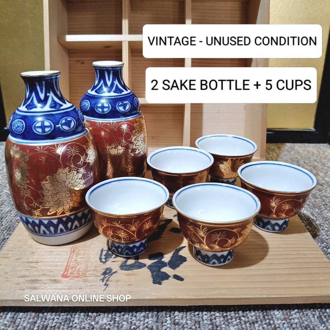 JAPAN SURPLUS VINTAGE KUTANI WARE SAKE SET (Category: Coffee & Tea Tableware) located in Mabalacat. Submitted by salwanaonlineshop (Listing ID 1428521042, Image 2). Description: JAPAN SURPLUS VINTAGE KUTANI WARE SAKE SET 🇯🇵 Vintage - Unused Condition 🇯🇵 With wooden box 🇯🇵 2 bottles + 5 cups 🇯🇵 No issue 🇯🇵 Japan Source 🛒 Follow us on S.H.O.P.E.E and L.A.Z.A.D.A at SALWANA ONLINE SHOP for more rare, vintage, collectible, unique surplus i