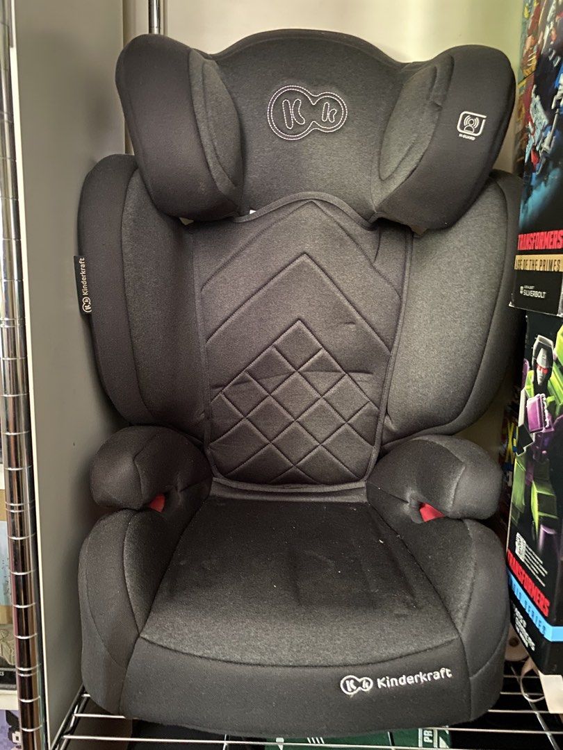 Kinderkraft Car Seat (Category: Car Seats) located in Makati City. Submitted by rye16 (Listing ID 1428605590, Image 1). Description: Kinderkraft car seat is designed for safety and comfort. It features a padded headrest and side supports for added protection. The seat has a diamond-stitched pattern on the backrest and a comfortable seat cushion. The Kinderkraft logo is visible on the front and side of the seat..