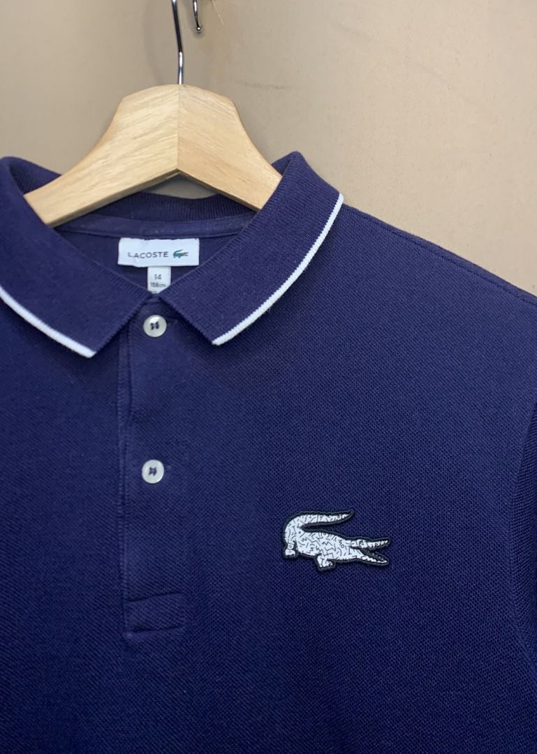 Lacoste Navy Blue Polo Shirt (Category: Tshirts & Polo Shirts ) located in Davao. Submitted by reclaimed_ph (Listing ID 1428469381, Image 2). Description: - Navy blue Lacoste Polo - Full zip - 16.5 x 23 - 9 Color rate - Very good condition - No issue .
