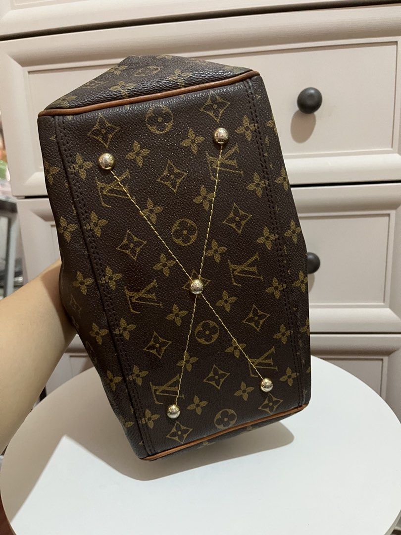 Louis Vuitton Monogram Canvas Bag (Category: Luxury Bags & Wallets) located in Manila. Submitted by sungjaneshop15 (Listing ID 1428436850, Image 2). Description: Louis Vuitton handbag in classic Monogram.Features a zip closure, leather handles, and a spacious interior with a pocket. The bag has a brown canvas exterior with the iconic LV pattern. The base has protective metal studs. Interior includes a small pocket and a leather tag with the seria