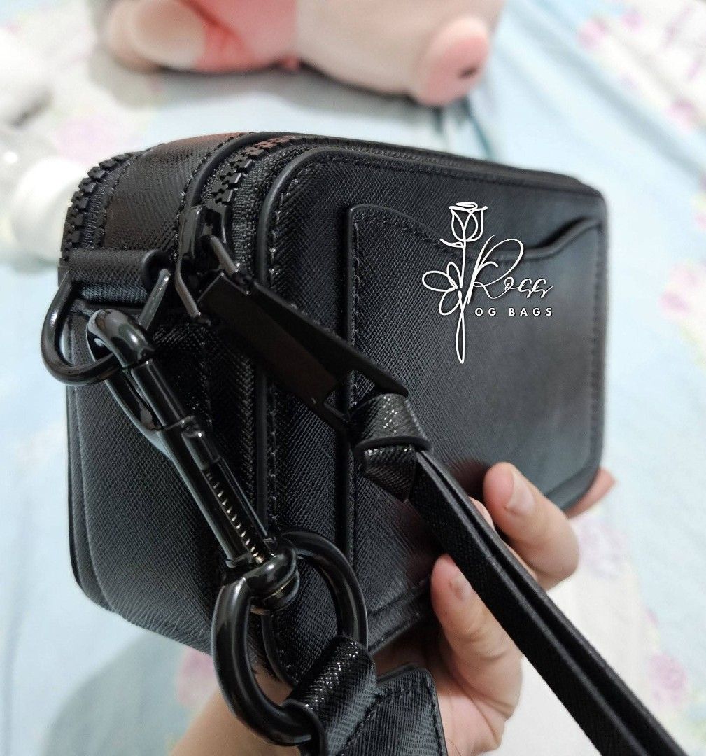 Marc Jacobs The Box Bag Black (Category: Luxury Bags & Wallets) located in Quezon City. Submitted by handpickerbag (Listing ID 1428428318, Image 3). Description: Black Marc Jacobs The Box Bag. Features a rectangular shape with a double-zip closure. Includes a detachable and adjustable shoulder strap. The bag has a textured finish and the iconic 'J' logo in black..