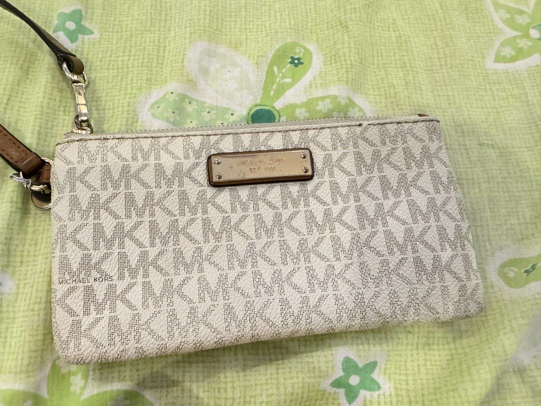 Michael Kors Wristlet (Category: Luxury Bags & Wallets) located in Tarlac. Submitted by TanGi_rine (Listing ID 1428468141, Image 1). Description: RFS: nakatambak lang.. See flaws sa last 2 photos.. Plus shipping fee...